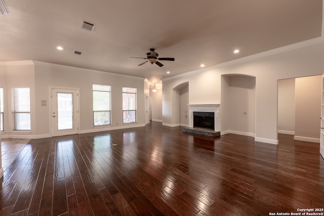 8718 Paseo Oaks, San Antonio, TX 78255 - unfurnished living room featuring ceiling fan, a fireplace with raised hearth, ornamental molding, baseboards, and dark wood-type flooring