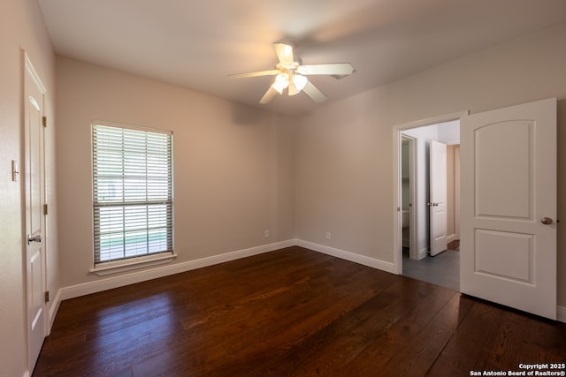 8718 Paseo Oaks, San Antonio, TX 78255 - unfurnished bedroom featuring dark wood finished floors, baseboards, and a ceiling fan