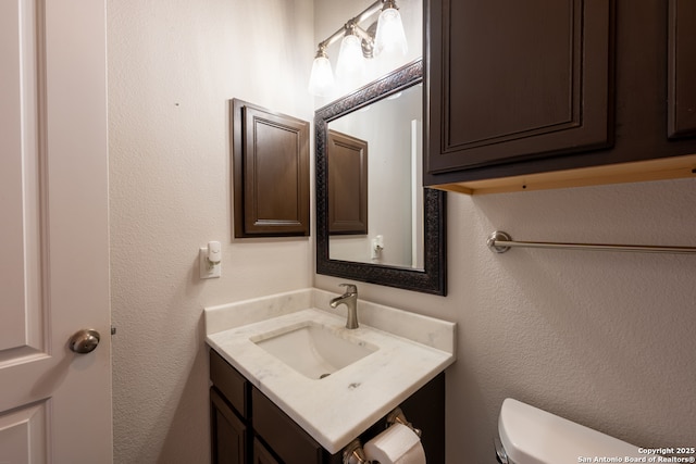 8718 Paseo Oaks, San Antonio, TX 78255 - half bathroom featuring vanity and toilet