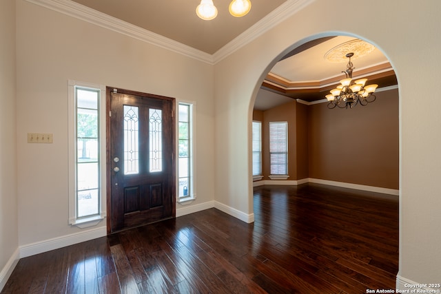 8718 Paseo Oaks, San Antonio, TX 78255 - entryway with arched walkways, a chandelier, ornamental molding, dark wood-style floors, and baseboards