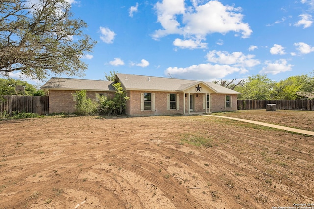 1312 Acorn, Hondo, TX 78861 - single story home with a fenced backyard and brick siding