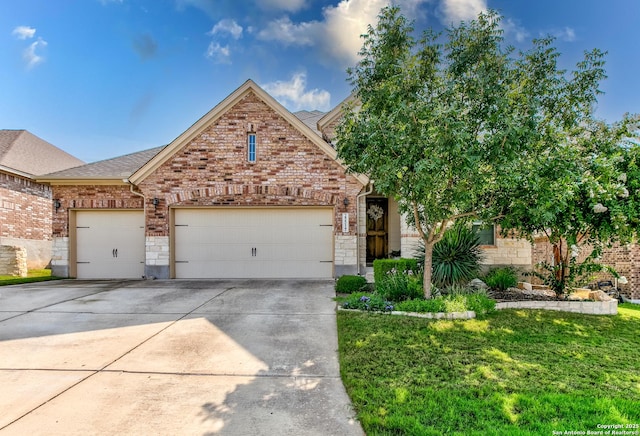25514 Vista Bella, San Antonio, TX 78260 - view of front facade featuring a garage, concrete driveway, brick siding, a front yard, and stone siding