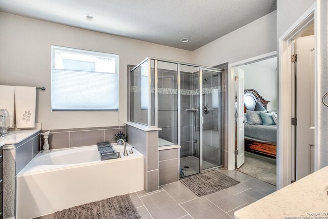 25514 Vista Bella, San Antonio, TX 78260 - bathroom with connected bathroom, a bath, tile patterned flooring, a stall shower, and vanity