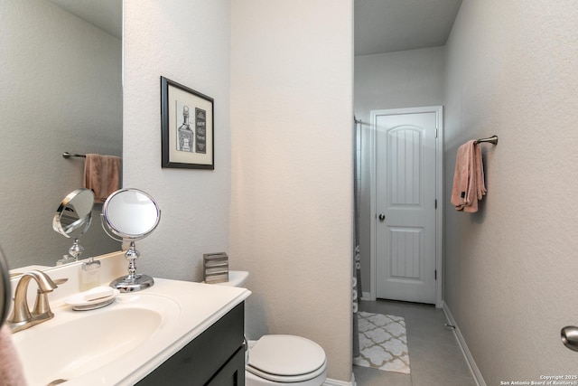 25514 Vista Bella, San Antonio, TX 78260 - bathroom with vanity, toilet, tile patterned flooring, and baseboards