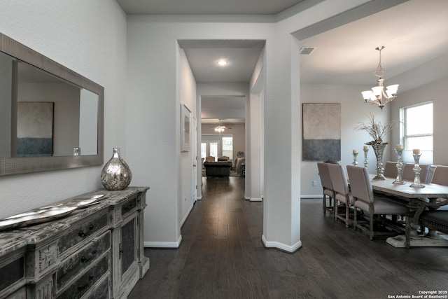 25514 Vista Bella, San Antonio, TX 78260 - dining room with dark wood-style flooring, plenty of natural light, a chandelier, and baseboards