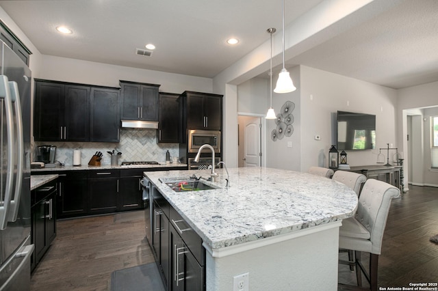 25514 Vista Bella, San Antonio, TX 78260 - kitchen with appliances with stainless steel finishes, a sink, dark wood-type flooring, decorative backsplash, and recessed lighting