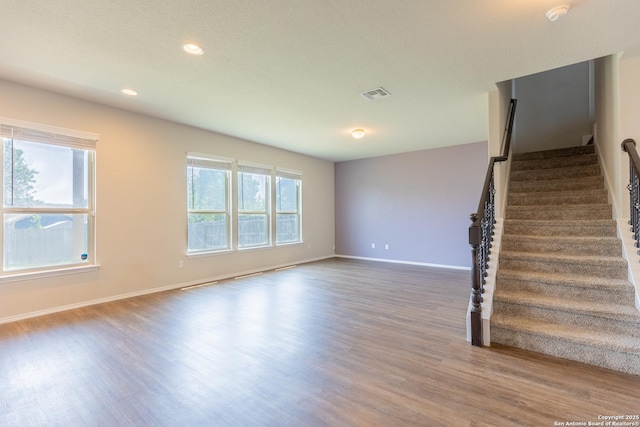 5930 Ivans Farm, San Antonio, TX 78244 - unfurnished living room with wood finished floors, stairway, baseboards, and recessed lighting