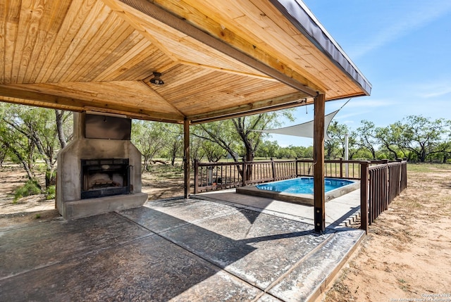 1556 County Road 2537, Moore, TX 78057 - view of patio / terrace with exterior fireplace