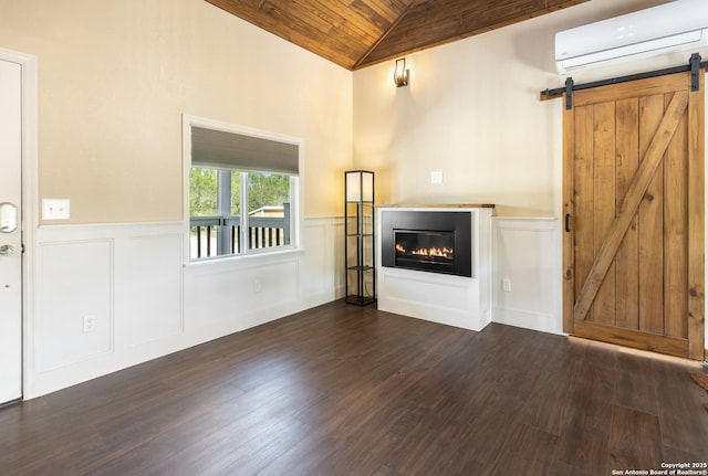 1556 County Road 2537, Moore, TX 78057 - unfurnished living room featuring a wall mounted air conditioner, lofted ceiling, wood ceiling, wainscoting, and dark wood-type flooring