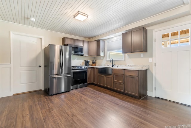 1556 County Road 2537, Moore, TX 78057 - kitchen with stainless steel appliances, a sink, plenty of natural light, dark wood-style flooring, and wood ceiling