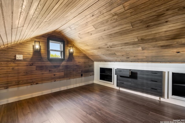 1556 County Road 2537, Moore, TX 78057 - additional living space featuring wood ceiling, wooden walls, vaulted ceiling, dark wood-style floors, and baseboards