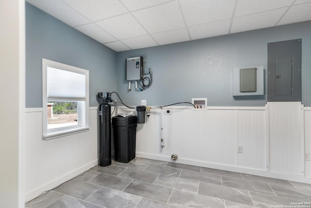 1556 County Road 2537, Moore, TX 78057 - washroom with electric panel, wainscoting, washer hookup, and gas dryer hookup