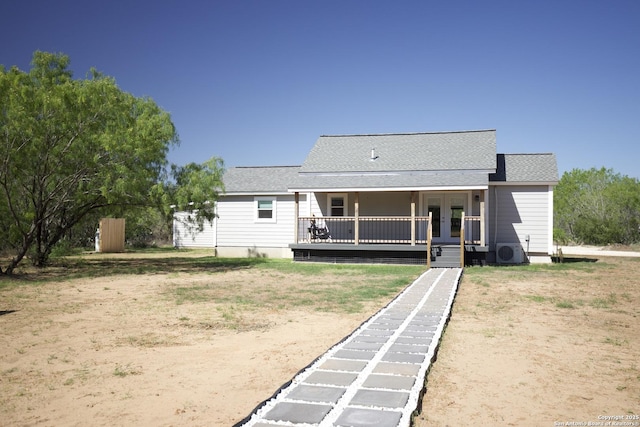 1556 County Road 2537, Moore, TX 78057 - rear view of house with french doors, roof with shingles, and ac unit