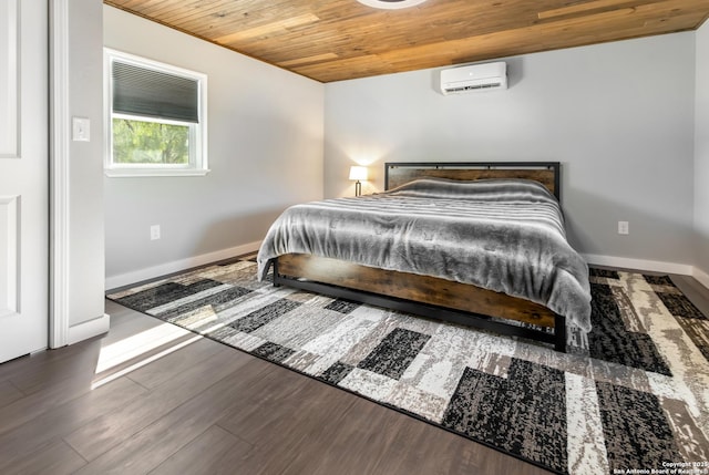 1556 County Road 2537, Moore, TX 78057 - bedroom with wooden ceiling, an AC wall unit, baseboards, and wood finished floors