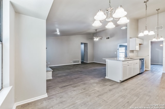 4203 Quail, San Antonio, TX 78217 - kitchen featuring a chandelier, white cabinets, stainless steel dishwasher, and high vaulted ceiling