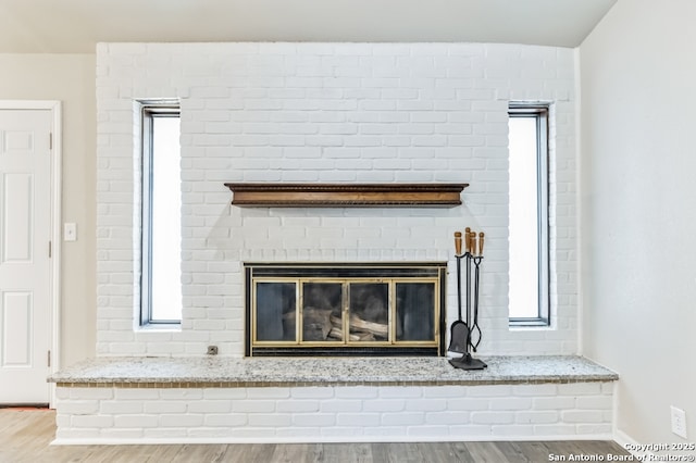4203 Quail, San Antonio, TX 78217 - detailed view of wood finished floors, a fireplace, and baseboards