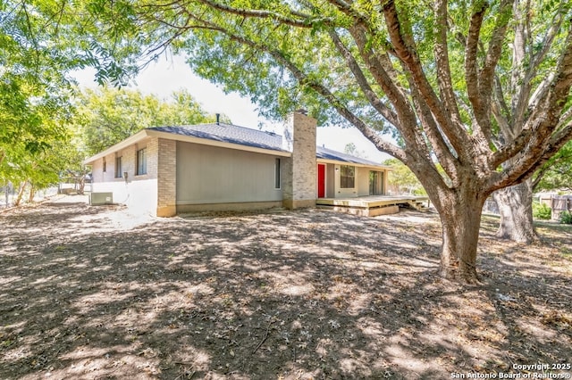 4203 Quail, San Antonio, TX 78217 - view of front of home featuring a chimney and central AC unit