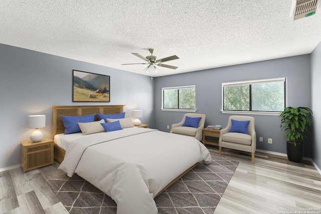 8134 Cheryl Mdw, Converse, TX 78109 - bedroom with wood finished floors, a textured ceiling, ceiling fan, and baseboards