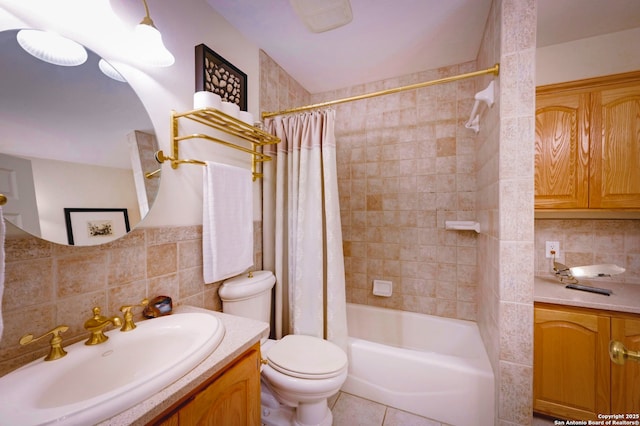 1231 Montell, Wimberley, TX 78676 - full bath featuring vanity, tile walls, toilet, shower / tub combo, and backsplash