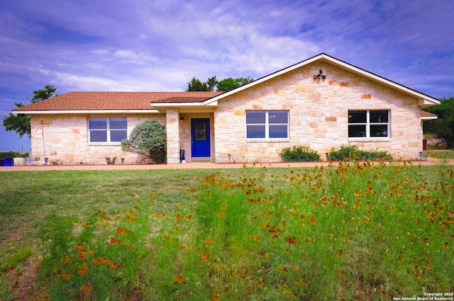 1231 Montell, Wimberley, TX 78676 - single story home with stone siding and a front lawn