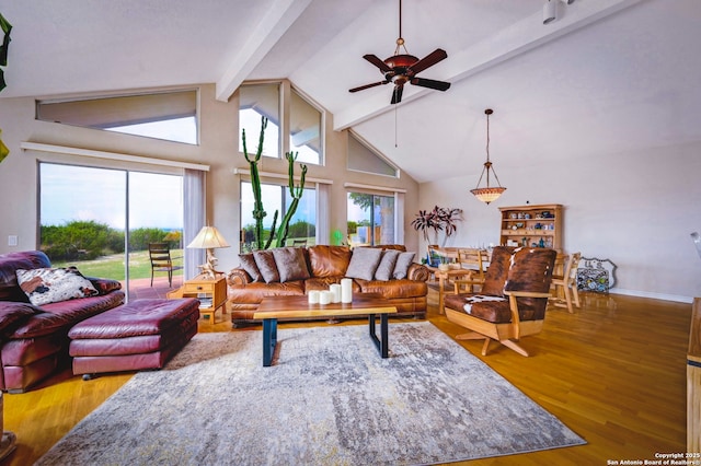 1231 Montell, Wimberley, TX 78676 - living room with beamed ceiling, wood finished floors, ceiling fan, high vaulted ceiling, and baseboards