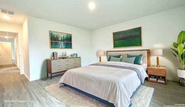 4211 Cove, San Antonio, TX 78223 - bedroom featuring wood finished floors and baseboards