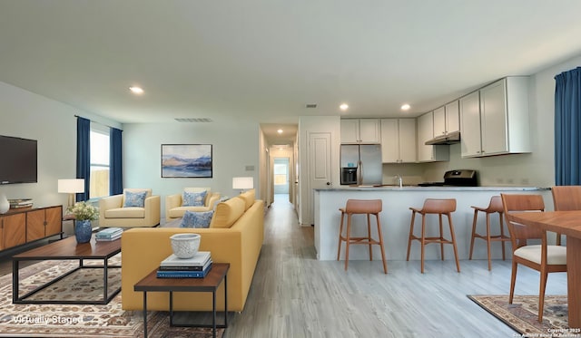 4211 Cove, San Antonio, TX 78223 - living room featuring light wood-style floors and recessed lighting