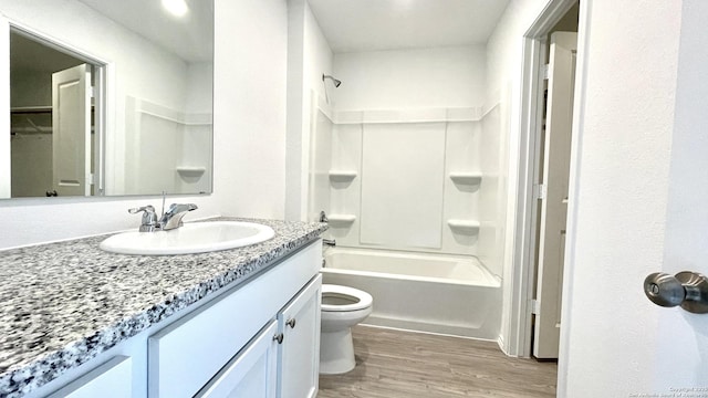 4211 Cove, San Antonio, TX 78223 - full bath with toilet, vanity, wood finished floors, and shower / bath combination