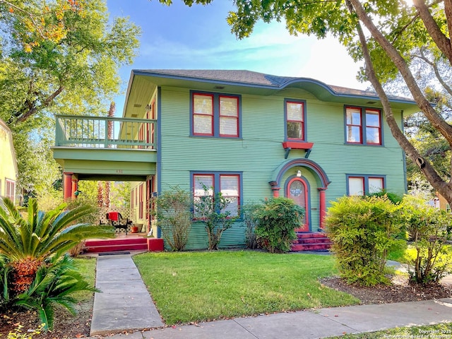 436 W Gramercy Pl, San Antonio, TX 78212 - view of front of home with a front yard and a balcony