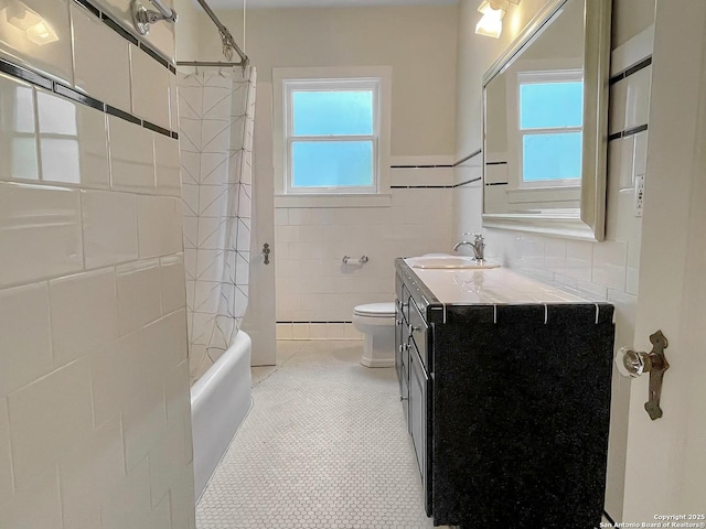 436 W Gramercy Pl, San Antonio, TX 78212 - full bathroom with vanity, toilet, tile walls, shower / tub combo, and tile patterned flooring