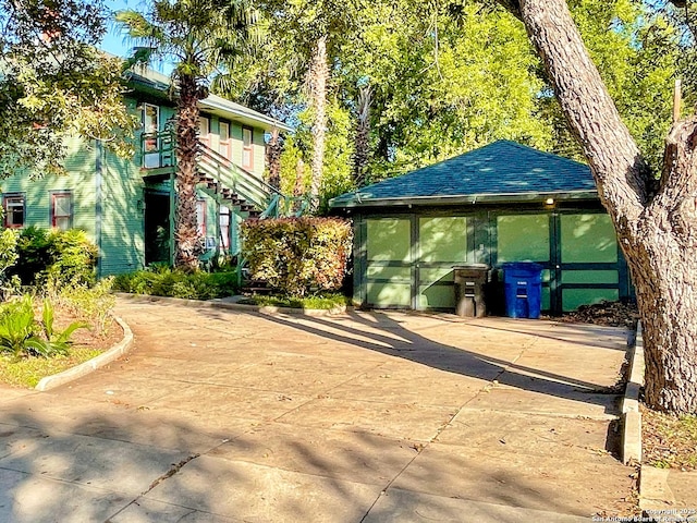 436 W Gramercy Pl, San Antonio, TX 78212 - view of front of house with stairs and a shingled roof