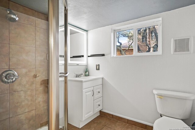 6806 Arrow, San Antonio, TX 78256 - bathroom with a shower stall, vanity, tile patterned flooring, and toilet