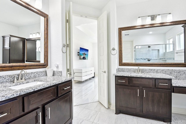 27118 Dana Creek Dr, Boerne, TX 78015 - full bathroom with two vanities, a tile shower, and marble look tile flooring