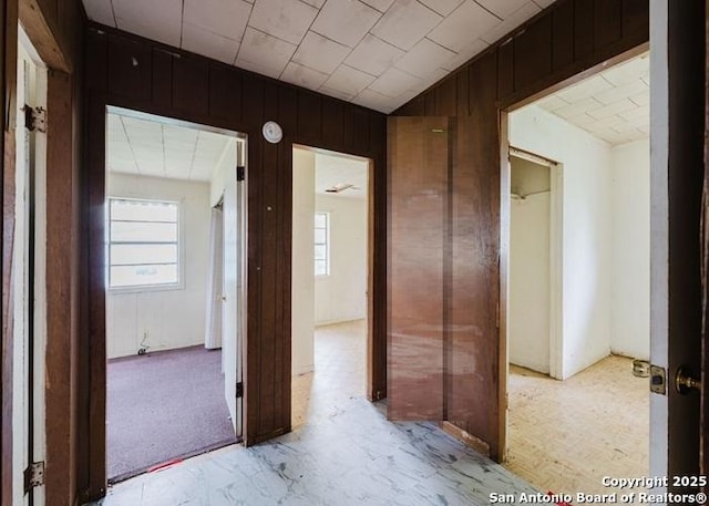 36 County Road 346c, Shiner, TX 77984 - corridor featuring wooden walls and vaulted ceiling