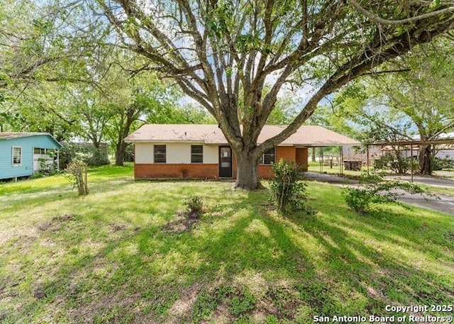 36 County Road 346c, Shiner, TX 77984 - ranch-style house featuring a front lawn and brick siding
