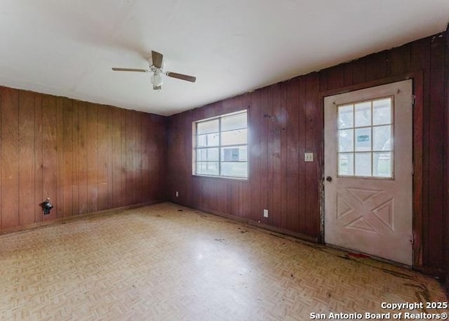 36 County Road 346c, Shiner, TX 77984 - entryway with ceiling fan and wood walls