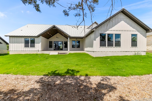 31 Peace Pipe, Wimberley, TX 78676 - rear view of property featuring a lawn, metal roof, and a standing seam roof