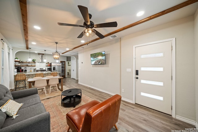 1341 Paso Hondo, San Antonio, TX 78202 - living room featuring arched walkways, recessed lighting, light wood-style flooring, ceiling fan, and baseboards