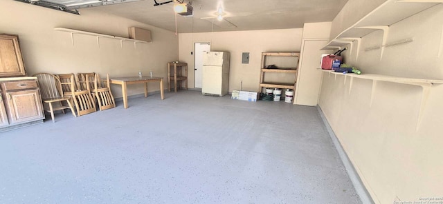 6115 Calderwood St, San Antonio, TX 78249 - garage featuring freestanding refrigerator, a garage door opener, and electric panel