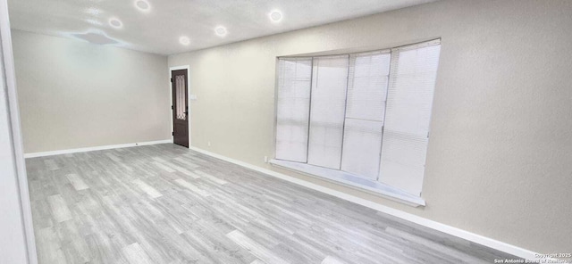 6115 Calderwood St, San Antonio, TX 78249 - empty room featuring wood finished floors and baseboards