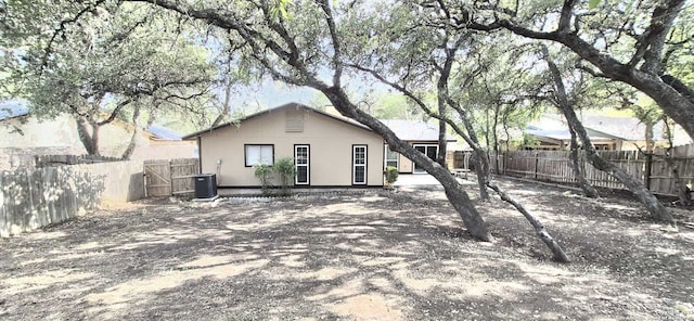 6115 Calderwood St, San Antonio, TX 78249 - back of house with a fenced backyard and central air condition unit