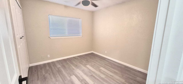 6115 Calderwood St, San Antonio, TX 78249 - unfurnished bedroom featuring wood finished floors, baseboards, and ceiling fan