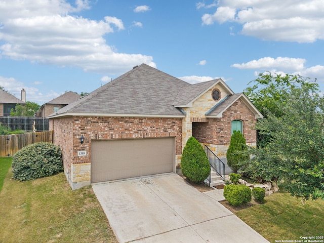 1388 Kamryn Way, New Braunfels, TX 78130 - view of front facade with brick siding, stone siding, a garage, and concrete driveway