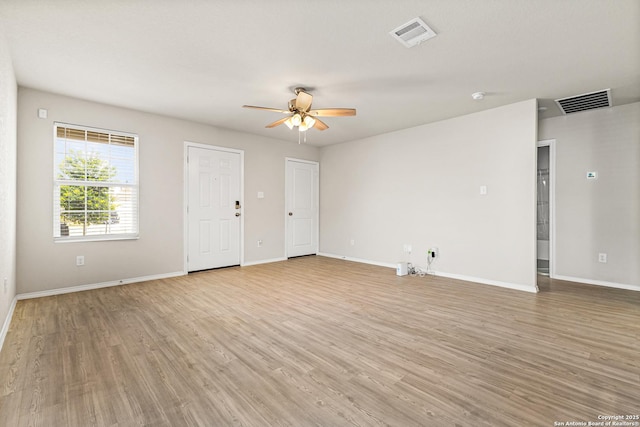 7207 Lincoln Trce, San Antonio, TX 78222 - unfurnished living room featuring ceiling fan, light wood finished floors, and baseboards