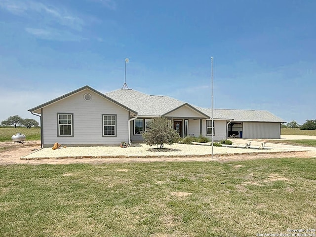 1185 County Road 7718, Devine, TX 78016 - ranch-style house featuring a front yard