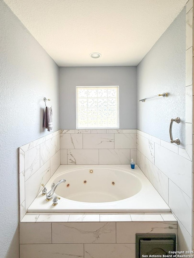 1185 County Road 7718, Devine, TX 78016 - bathroom featuring a tub with jets
