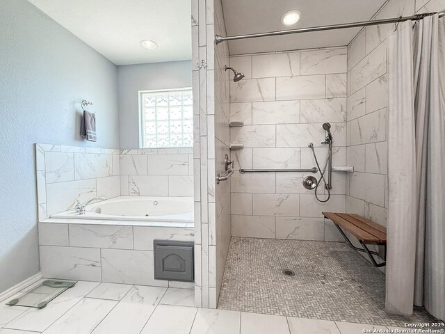 1185 County Road 7718, Devine, TX 78016 - bathroom with a bath, marble look tiles, a tile shower, recessed lighting, and baseboards