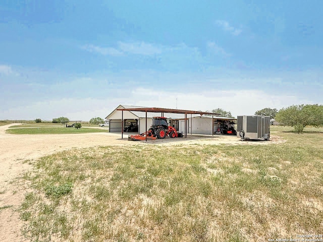 1185 County Road 7718, Devine, TX 78016 - view of outdoor structure with dirt driveway