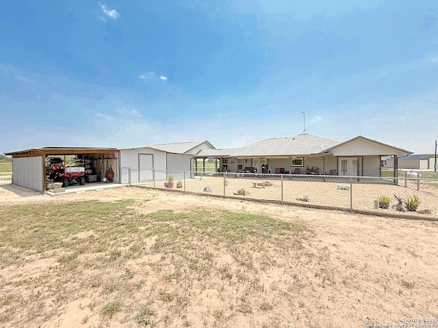1185 County Road 7718, Devine, TX 78016 - view of front of house featuring an outdoor structure