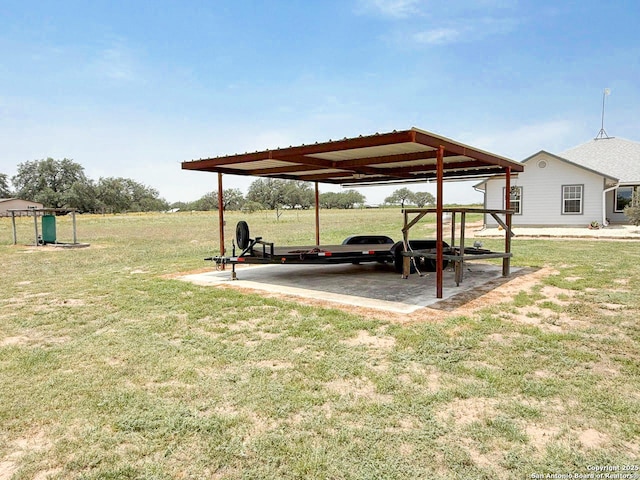 1185 County Road 7718, Devine, TX 78016 - view of green lawn featuring a carport